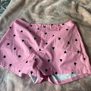 SHEIN pink shorts with black hearts